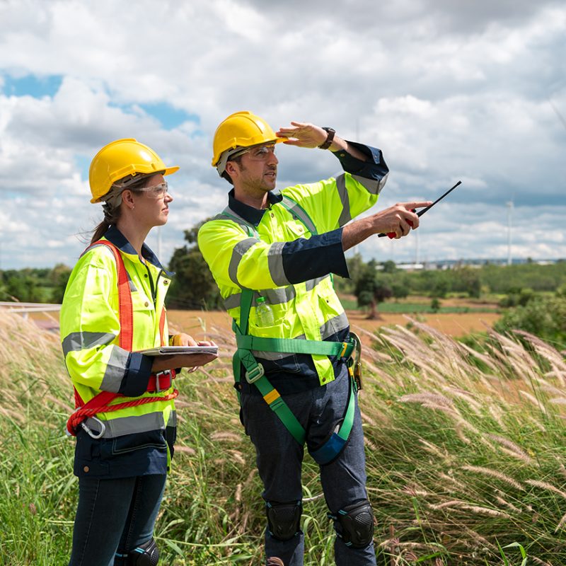 people engineer are wearing a protective helmet on head, using tablet Analytics engineering data