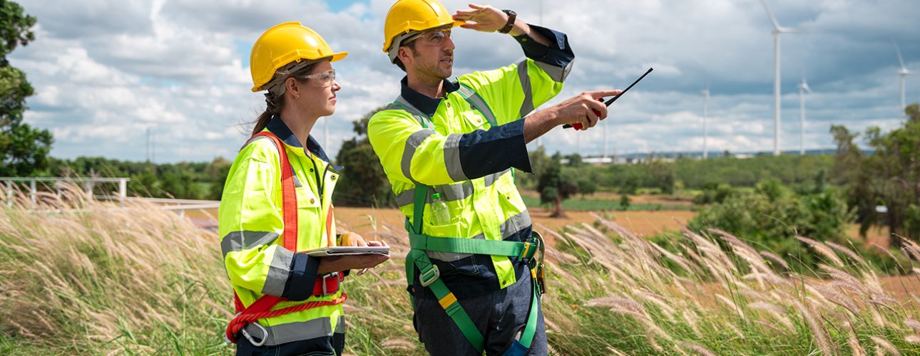 people engineer are wearing a protective helmet on head, using tablet Analytics engineering data